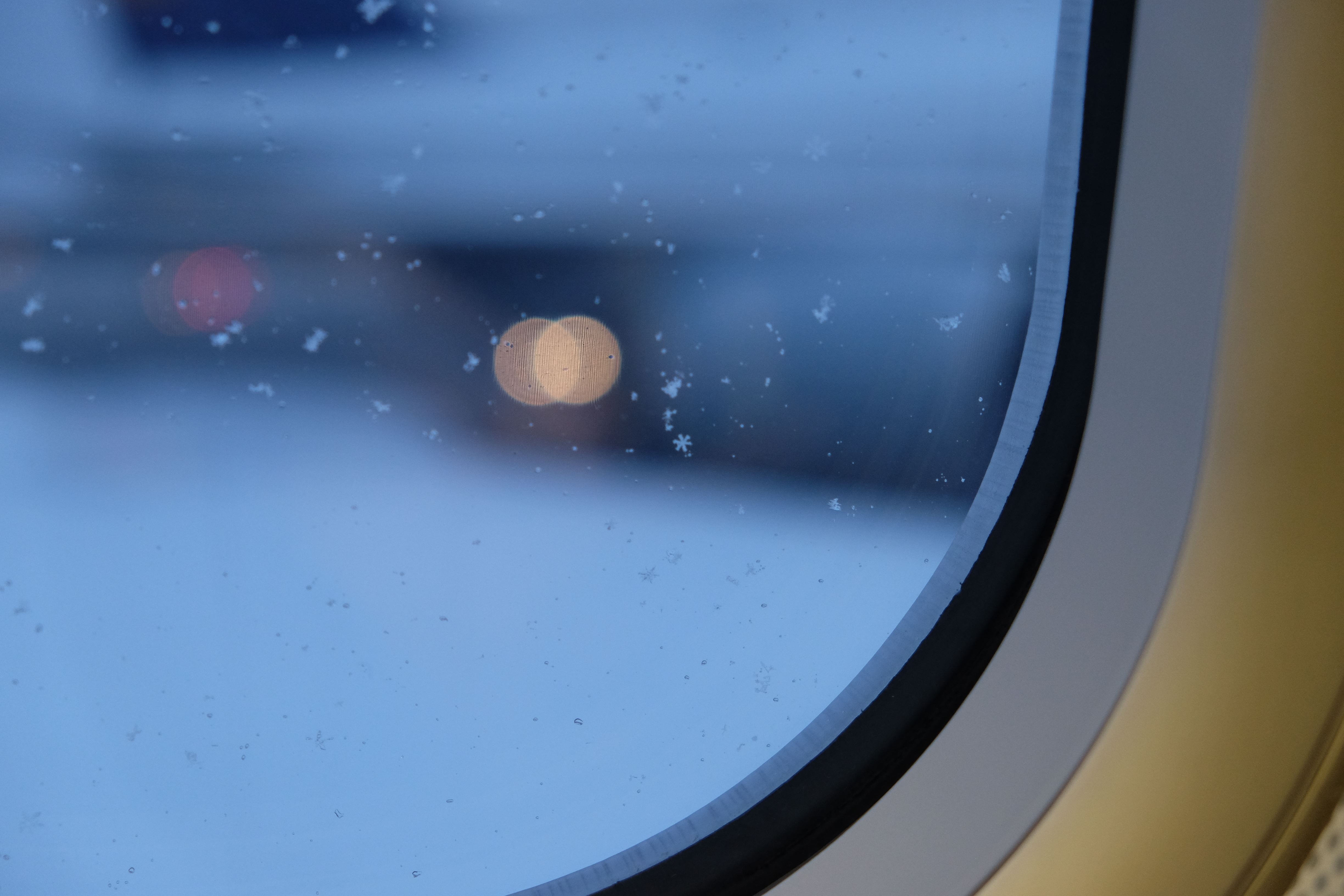 Snowflake on airplane window