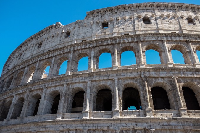 The Colosseum exterior against a blue sky