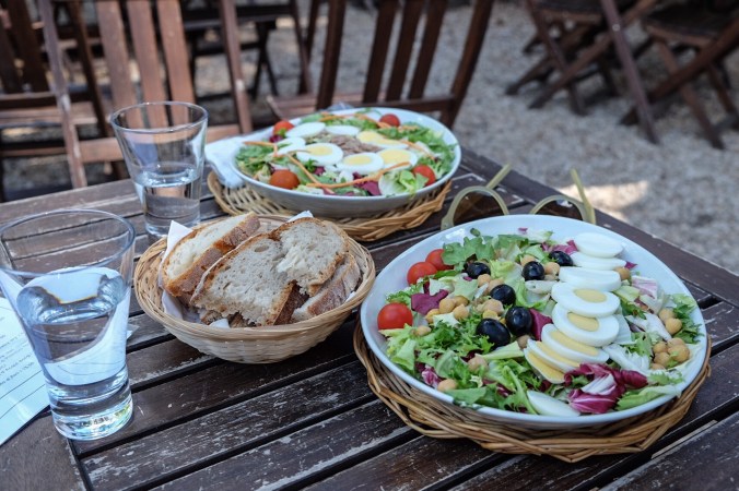 Fresh salads at an outdoor table in the countryside outside of Rome
