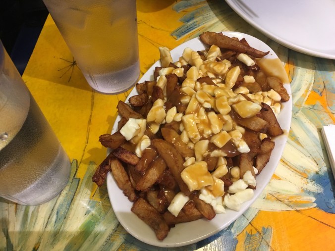 Eating Poutine at the Montreal classic La Banquise