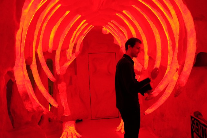 Sam at Meow Wolf playing with one of the interactive musical installations