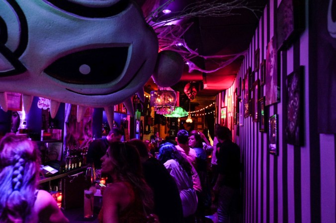 Walking into Beetle House with cobwebs and purple lighting